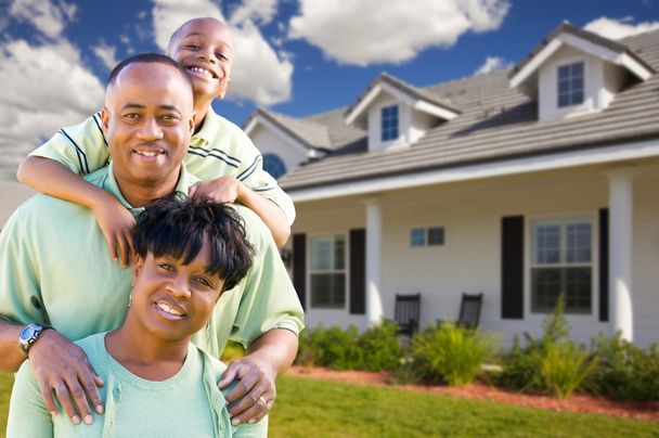 A family in front of their home